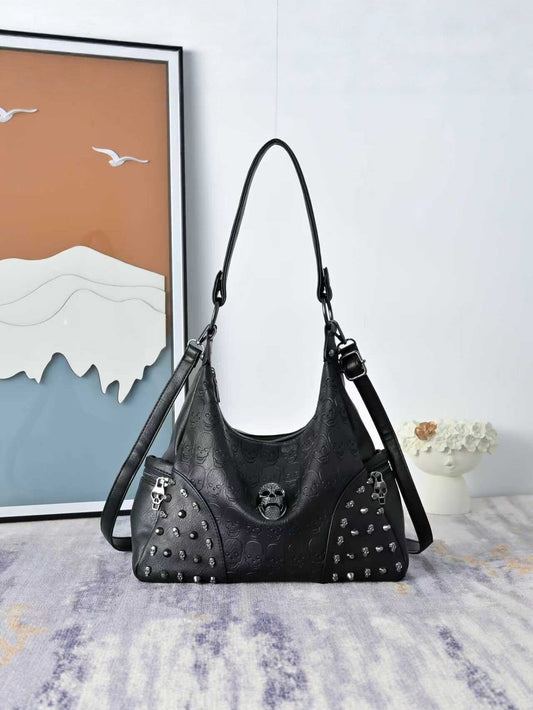 Black skull-embossed rivet hobo shoulder bag for alternative outfits