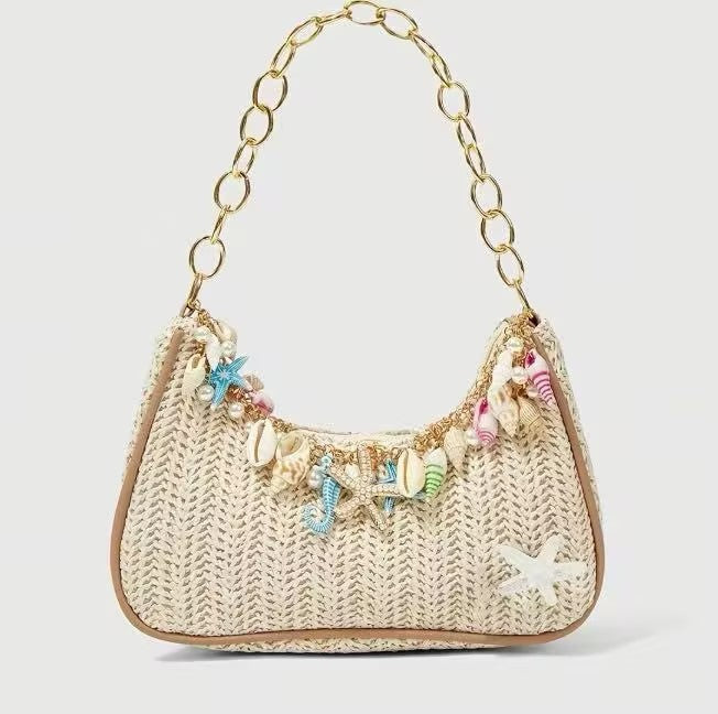 Chain Accent Woven Underarm Bag with colorful ocean-inspired pendants