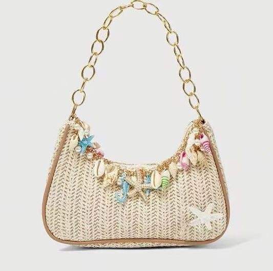 Chain Accent Woven Underarm Bag with colorful ocean-inspired pendants