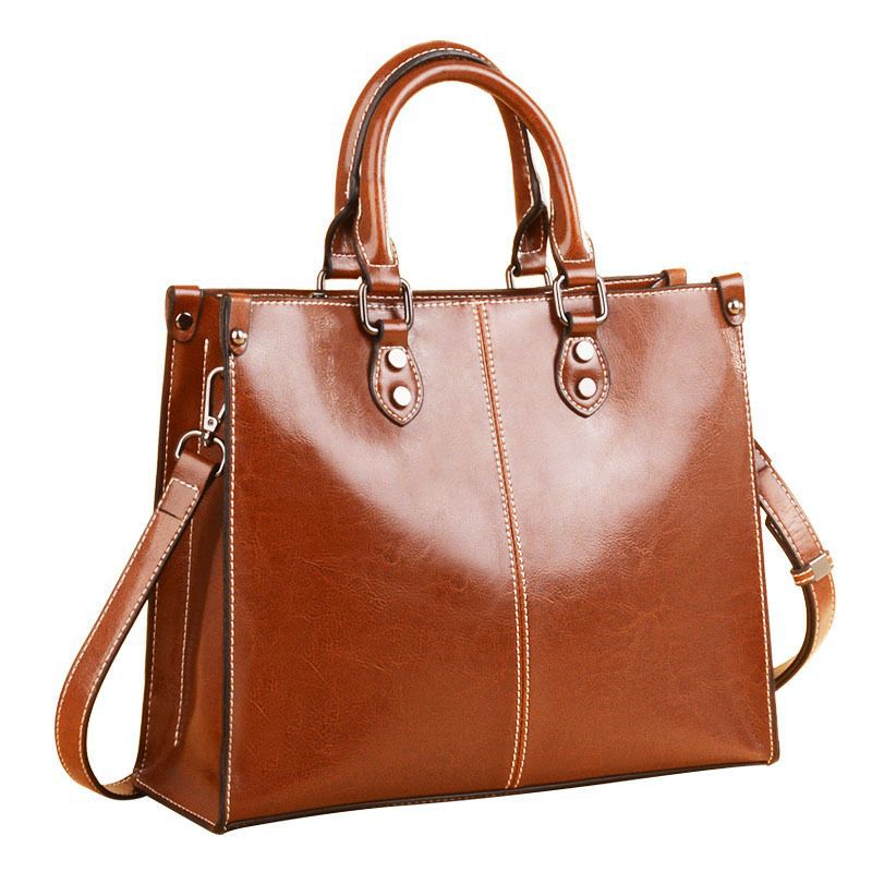 Brown structured vintage-look tote with top handles and long strap